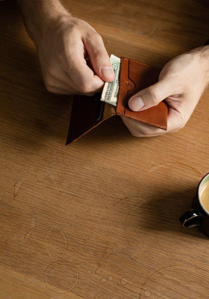 The Cognac Nimrodian Bi-Fold Card Case from VOID Watches, designed by David Ericsson.